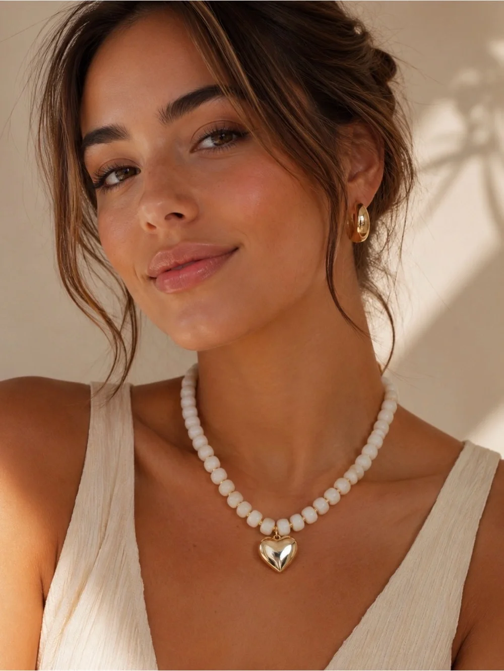 White Beaded Necklace with Gold Heart Pendant